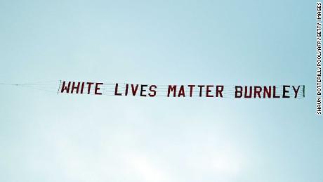 TOPSHOT - A banner reading &#39;White Lives Matter Burnley&#39; is towed by a plane above the stadium during the English Premier League football match between Manchester City and Burnley at the Etihad Stadium in Manchester, north west England, on June 22, 2020. (Photo by Shaun Botterill / POOL / AFP) / RESTRICTED TO EDITORIAL USE. No use with unauthorized audio, video, data, fixture lists, club/league logos or &#39;live&#39; services. Online in-match use limited to 120 images. An additional 40 images may be used in extra time. No video emulation. Social media in-match use limited to 120 images. An additional 40 images may be used in extra time. No use in betting publications, games or single club/league/player publications. /  (Photo by SHAUN BOTTERILL/POOL/AFP via Getty Images)