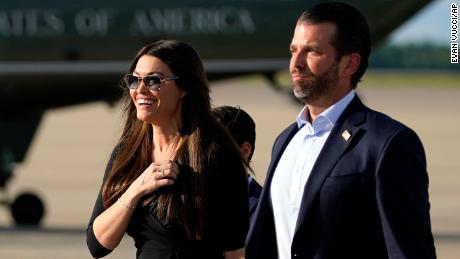 Donald Trump Jr., walks with Kimberly Guilfoyle after arriving at Andrews Air Force Base, Md., Wednesday, May 27, 2020, after traveling to Florida, with President Donald Trump. (AP Photo/Evan Vucci)