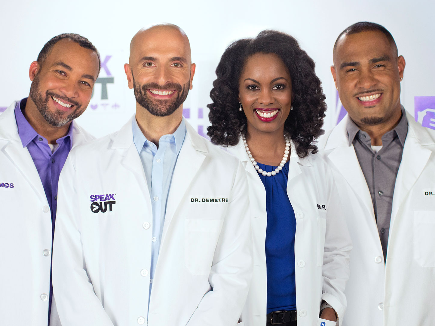 Four HIV specialists smiling
